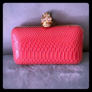 Skull snake print clutch